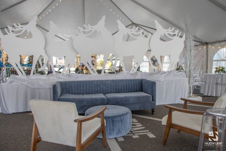 Holiday-Party-Decor-Blue-Couch-Reindeer-Backdrop