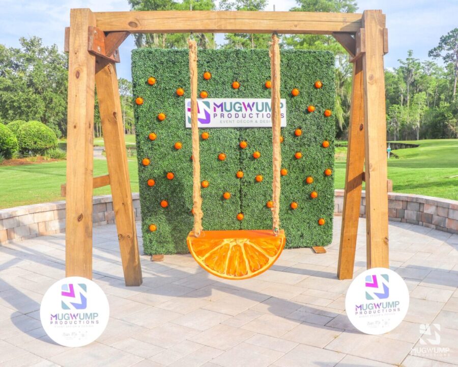 Orange-Slice-Swing-And-Greenery-Wall