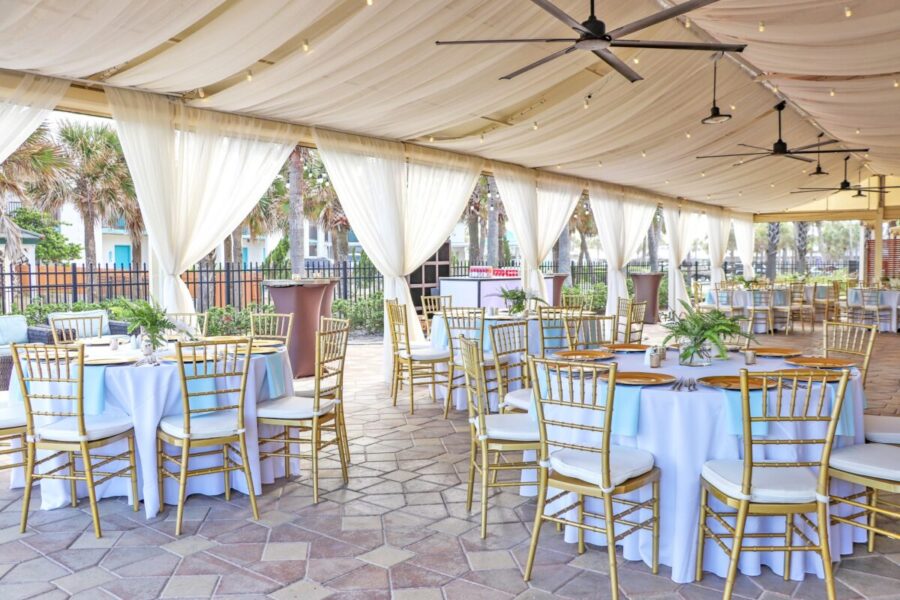outdoor-wedding-tent-with-white-linens-1200x800