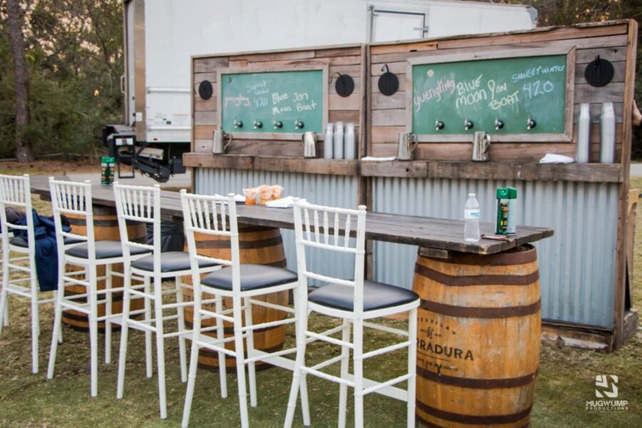Outside-Rustic-Bar-White-Barstools-Wood-Barrel-Decor