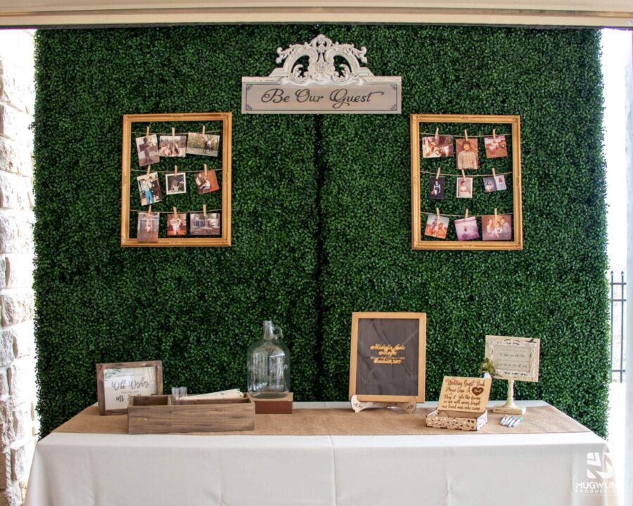 Wedding-Reception-Welcome-Table-Gold-Picture-Frames-Greenery-Wall